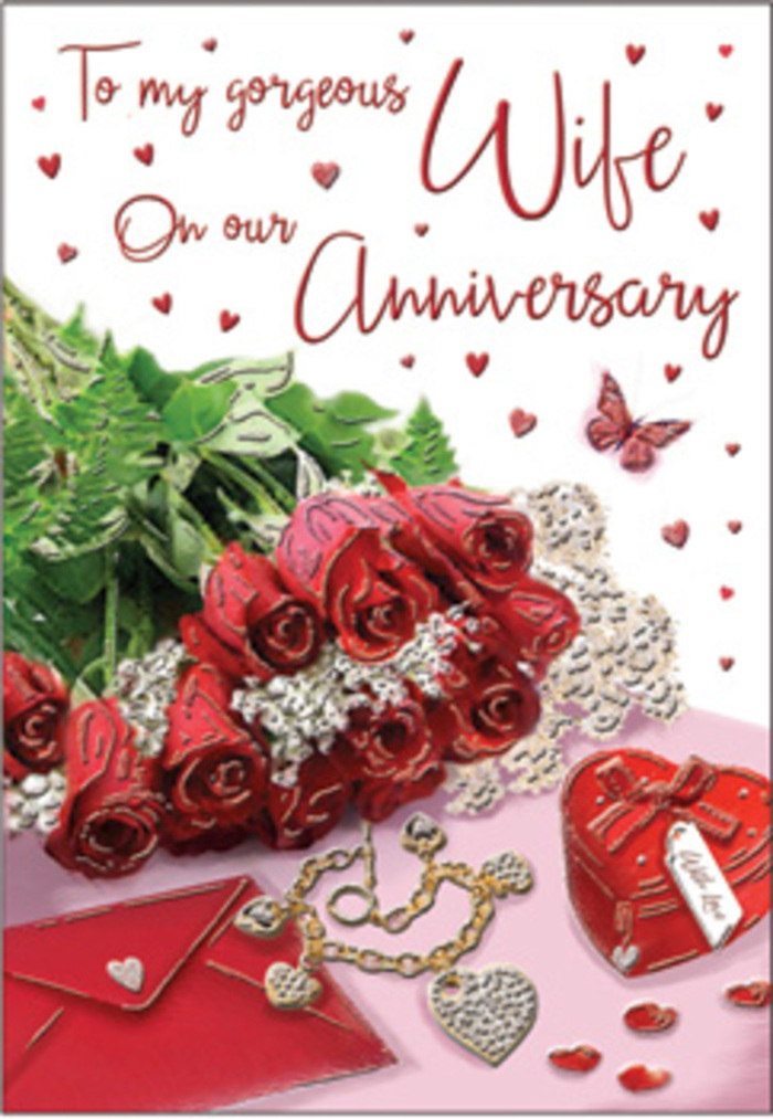 An evocative anniversary scene unfolds as a bouquet of classic red roses takes pride of place, arranged with the kind of quiet confidence you might expect from a Canonbury florist who has spent years crafting romantic gestures. The roses are gathered tightly together, each bloom full and velvety, their petals spiralling inwards in rich crimson tones that convey depth of feeling and enduring affection. Threads of fresh green foliage weave between the flowers, adding airiness and contrast, as if the stems have just been trimmed and placed down on a polished table near Canonbury Square. To one side, an elegant envelope lies partly visible, its smooth, light-coloured surface a calm backdrop hinting at a handwritten anniversary message within. Nearby, a refined piece of jewellery glints-perhaps a necklace or bracelet chosen as a special gift-its metal catching the gentle daylight. A small heart-shaped box in a vibrant red sits close to the roses, mirroring their colour and suggesting a treasured keepsake or hidden surprise. Scattered around the composition are tiny heart decorations and a single butterfly motif, their shapes delicate and almost playful, like confetti left after a celebration. The lighting is soft and diffused, with highlights tracing the curve of each petal and the gleam of each decorative piece, while shadows remain mild and flattering. The entire arrangement feels warm, intimate, and sincere, like a moment paused between two people celebrating another year together in Canonbury, perhaps after a quiet walk along New River Walk or a cosy dinner at home.